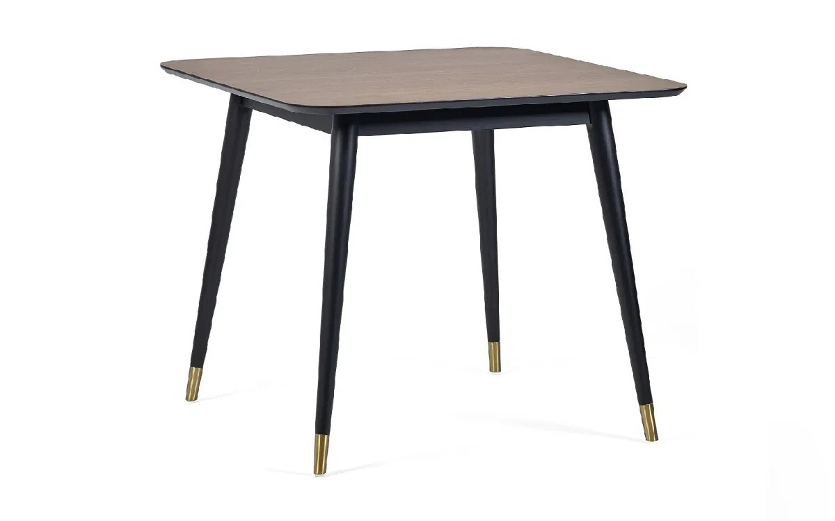 Retro-Inspired Design, combined with mid-century style with modern detailing for a timeless dining centrepiece. Walnut Finish with Brass-Tipped Black Legs. H75xL90xW90cm. www.nobleandnook.co.uk