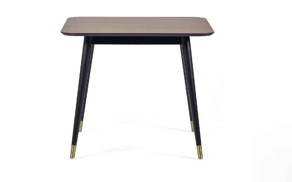 Retro-Inspired Design, combined with mid-century style with modern detailing for a timeless dining centrepiece. Walnut Finish with Brass-Tipped Black Legs. H75xL90xW90cm. www.nobleandnook.co.uk