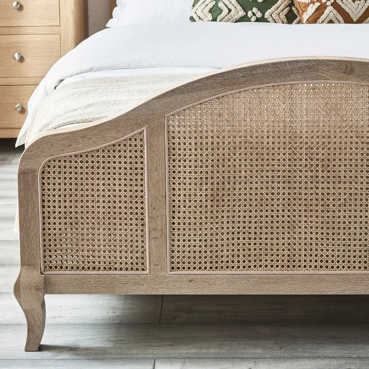 Shop the Château Rattan Bed in Light Oak, featuring an arched headboard and footboard with intricate rattan panelling. Free UK Mainland Delivery. Shop online todat at www.nobleandnook.co.uk