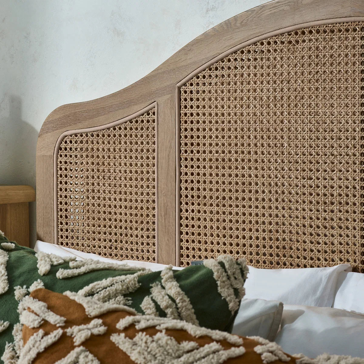 Shop the Château Rattan Bed in Light Oak, featuring an arched headboard and footboard with intricate rattan panelling. Free UK Mainland Delivery. Shop online todat at www.nobleandnook.co.uk