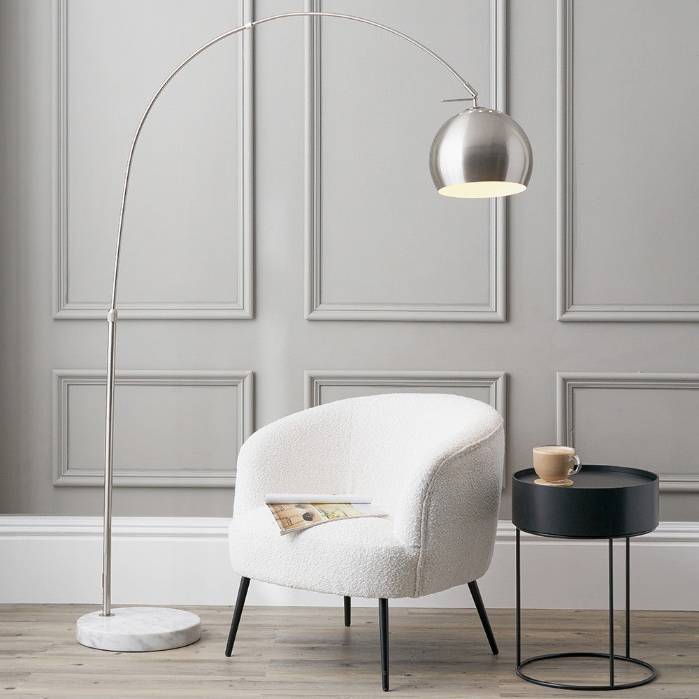 This exquisite floor lamp boasts a brushed silver finish and a solid white marble base, exuding sleek sophistication. FREE UK MAINLAND DELIVERY. Shop online now at www.nobleandnook.co.uk