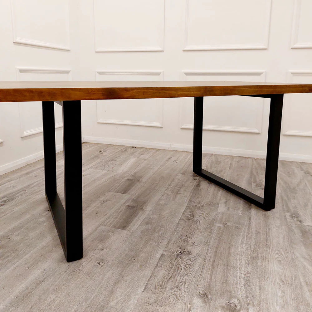 The Freya 1.8m Dining Table is a stunning blend of rustic charm and modern industrial design. Crafted from solid dark pine wood and paired with sleek matte black metal legs. Shop online today at www.nobleandnook.co.uk
