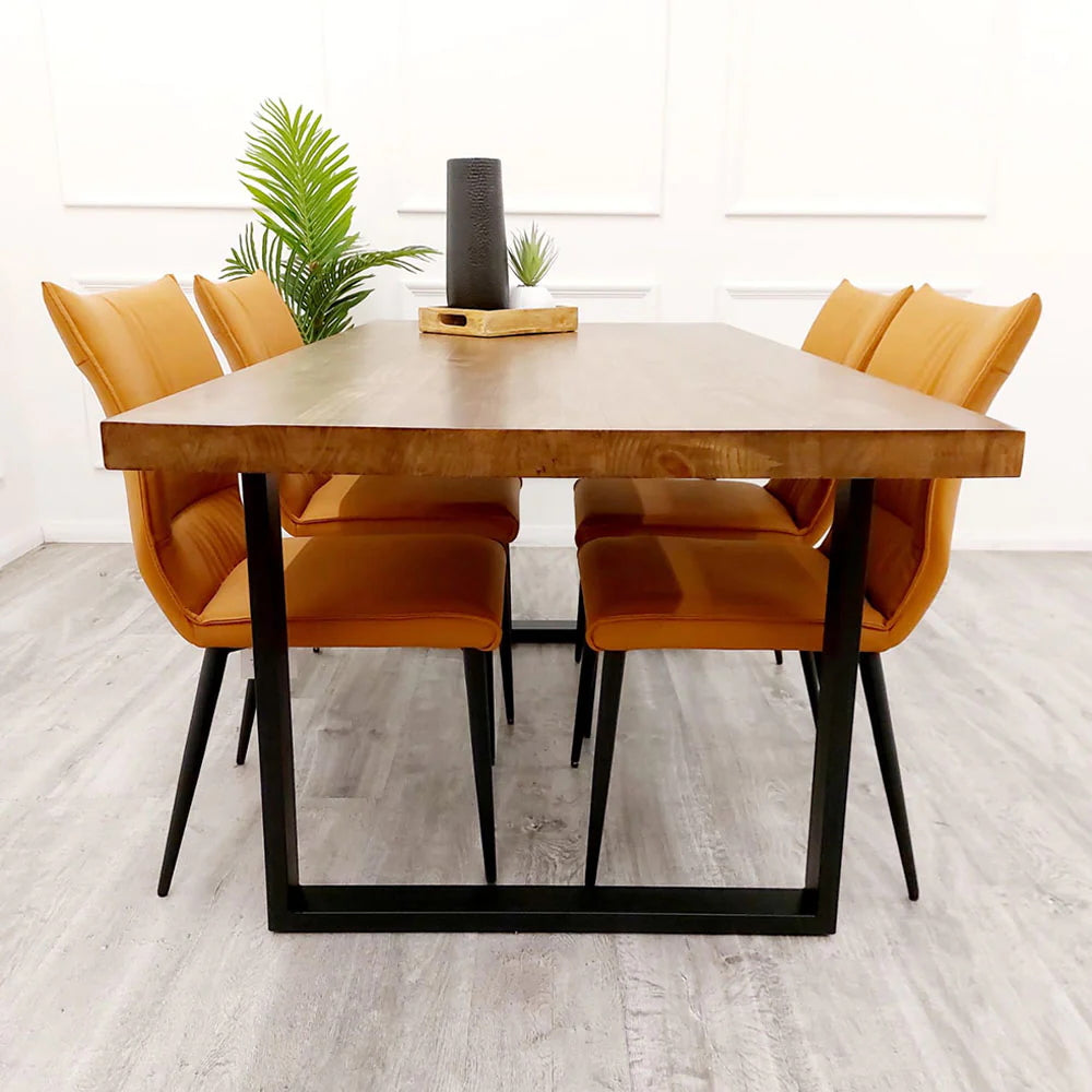 The Freya 1.8m Dining Table is a stunning blend of rustic charm and modern industrial design. Crafted from solid dark pine wood and paired with sleek matte black metal legs. Shop online today at www.nobleandnook.co.uk