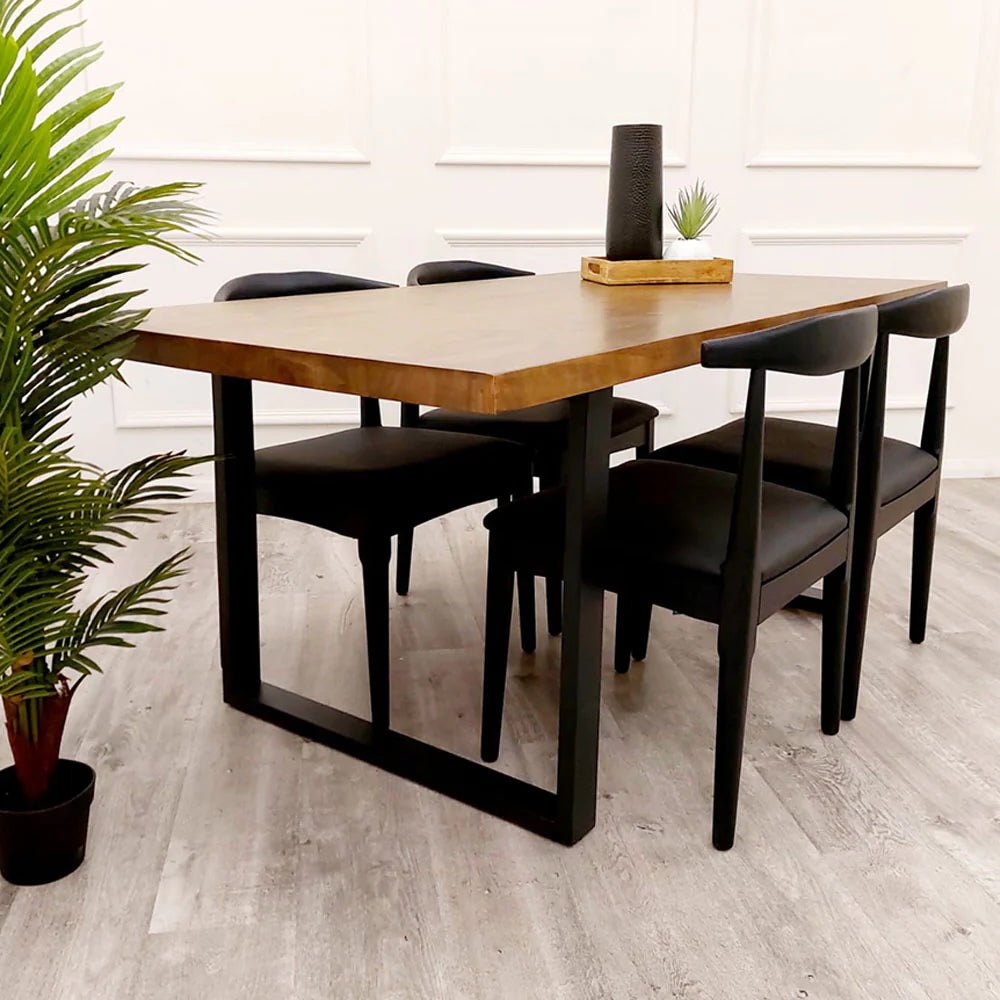 The Freya 1.8m Dining Table is a stunning blend of rustic charm and modern industrial design. Crafted from solid dark pine wood and paired with sleek matte black metal legs. Shop online today at www.nobleandnook.co.uk