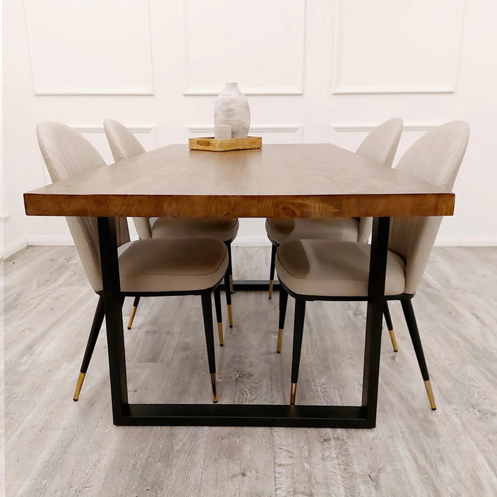The Freya 1.8m Dining Table is a stunning blend of rustic charm and modern industrial design. Crafted from solid dark pine wood and paired with sleek matte black metal legs. Shop online today at www.nobleandnook.co.uk