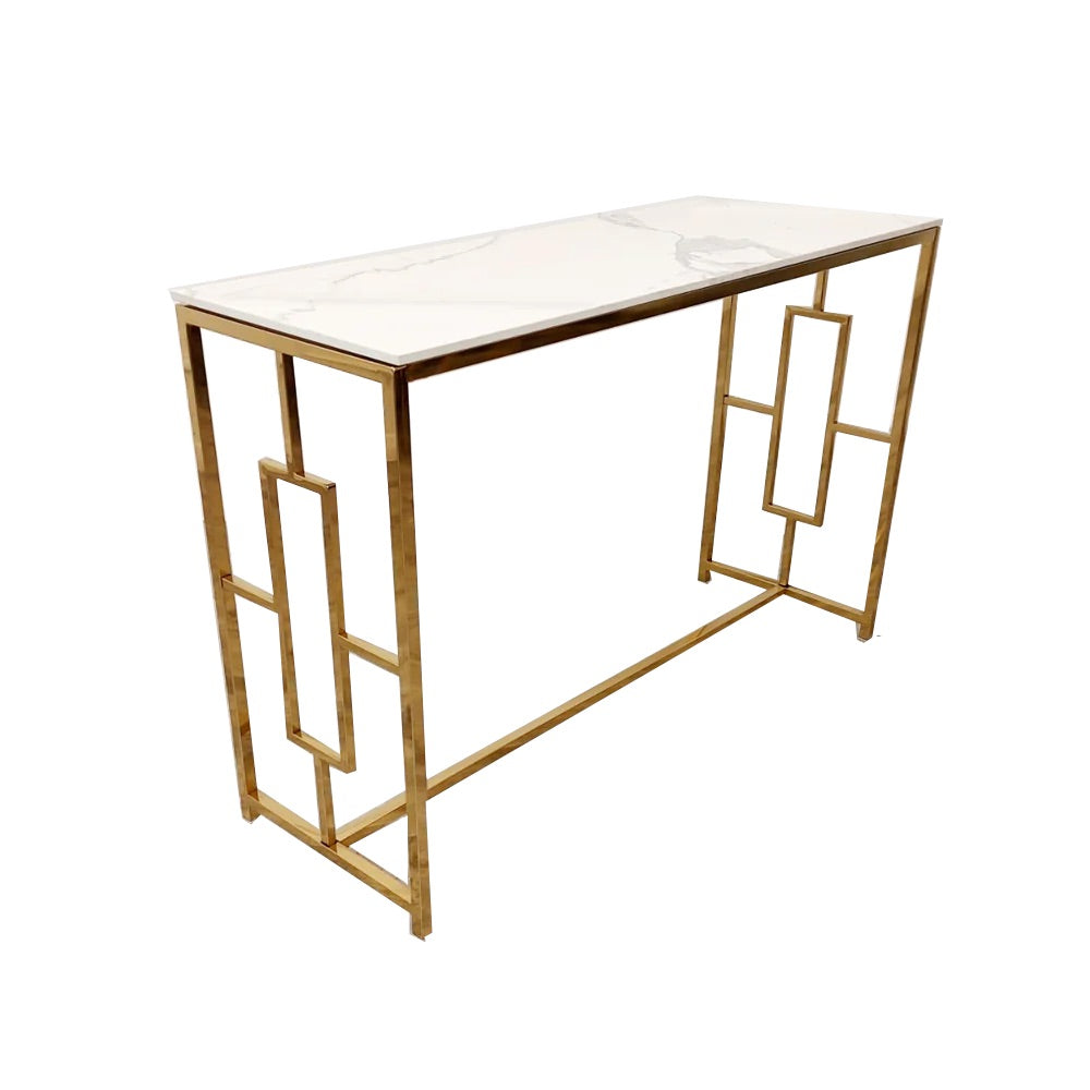 Add instant glamour to your home with this Console Table, featuring a bold, squared geometric frame in a radiant gold finish and a sleek Polar White Sintered Stone top. Shop online today at www.nobleandnook.co.uk