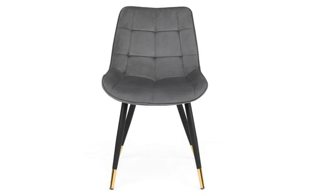 The Hadid Dining Chair brings sophistication to your space with its soft velvet upholstery and eye-catching black-and-gold leg design. Pair them with a sleek dining table. Shop online today at www.nobleandnook.co.uk