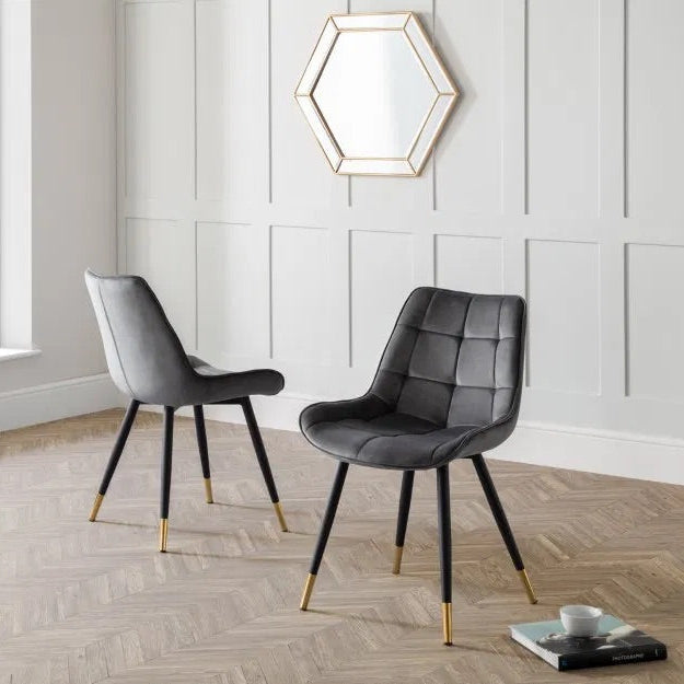 The Hadid Dining Chair brings sophistication to your space with its soft velvet upholstery and eye-catching black-and-gold leg design. Pair them with a sleek dining table. Shop online today at www.nobleandnook.co.uk