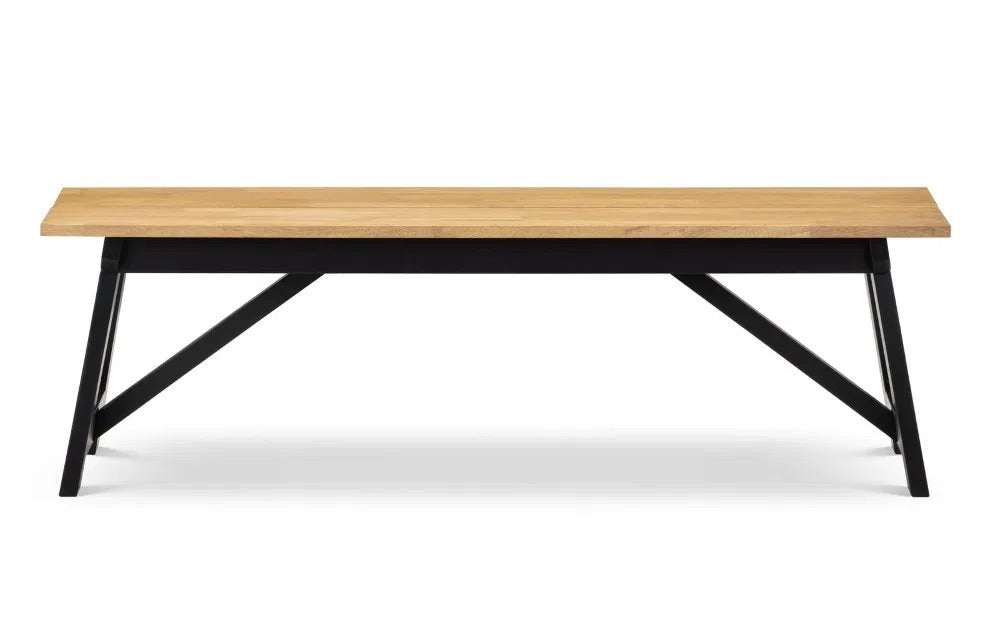 Shop the Hockley Dining Bench in Black/Oak a stylish and practical addition to your dining space. Crafted with a solid rubberwood top and a black painted trestle base. Shop online now at www.nobleandnook.co.uk