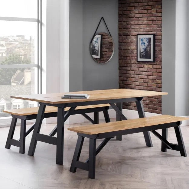 Shop the Hockley Dining Bench in Black/Oak a stylish and practical addition to your dining space. Crafted with a solid rubberwood top and a black painted trestle base. Shop online now at www.nobleandnook.co.uk