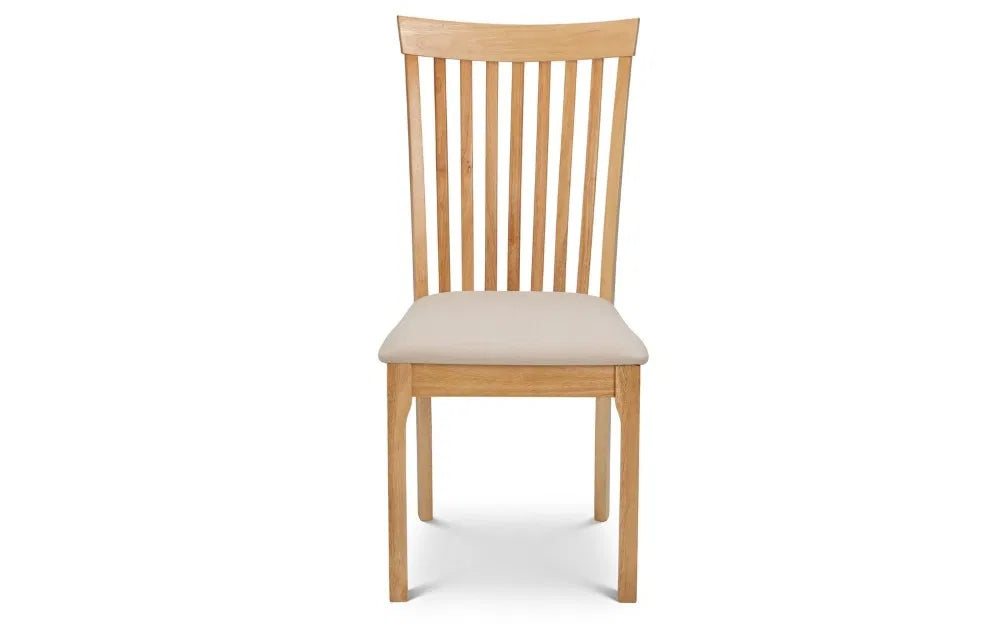 Upgrade your dining space with the Belson Dining Chair, a refined take on the classic shaker design. Expertly crafted from durable hardwood with a light oak finish. Shop online today at www.nobleandnook.co.uk