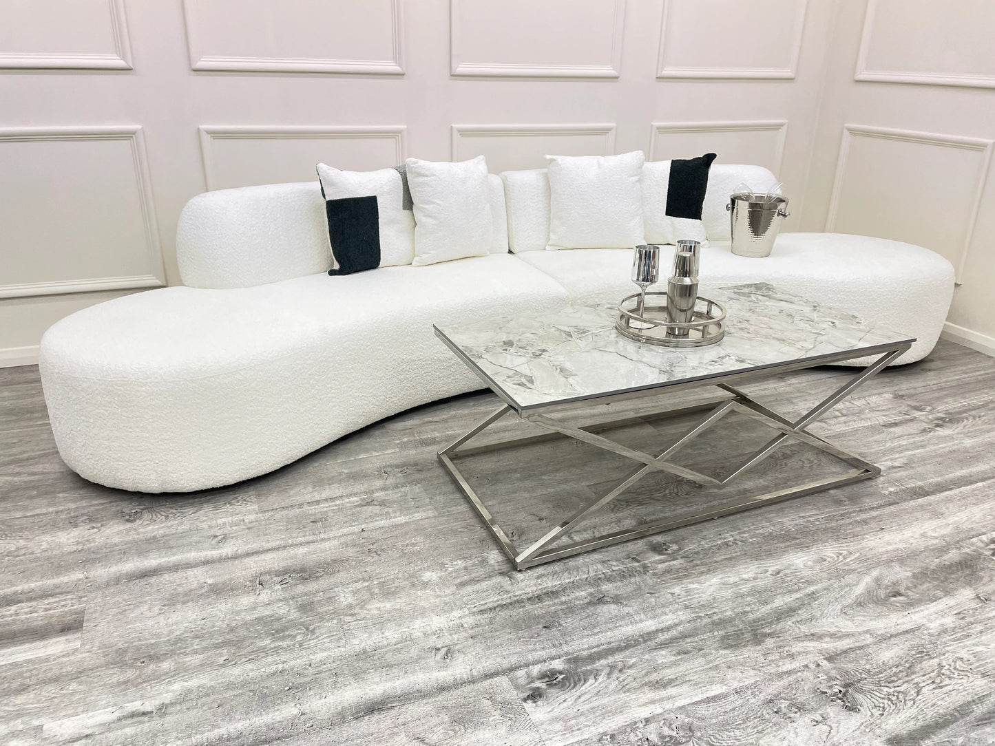 The Miami Curved Cinema Sofa, upholstered in soft and textured bouclé fabric. Perfect for a home games room or home cinema. Shop online today at www.nobleandnook.co.uk