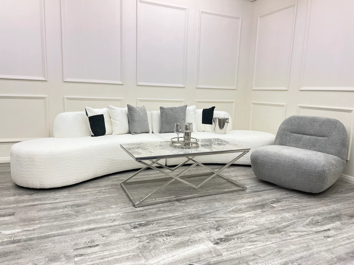 The Miami Curved Cinema Sofa, upholstered in soft and textured bouclé fabric. Perfect for a home games room or home cinema. Shop online today at www.nobleandnook.co.uk