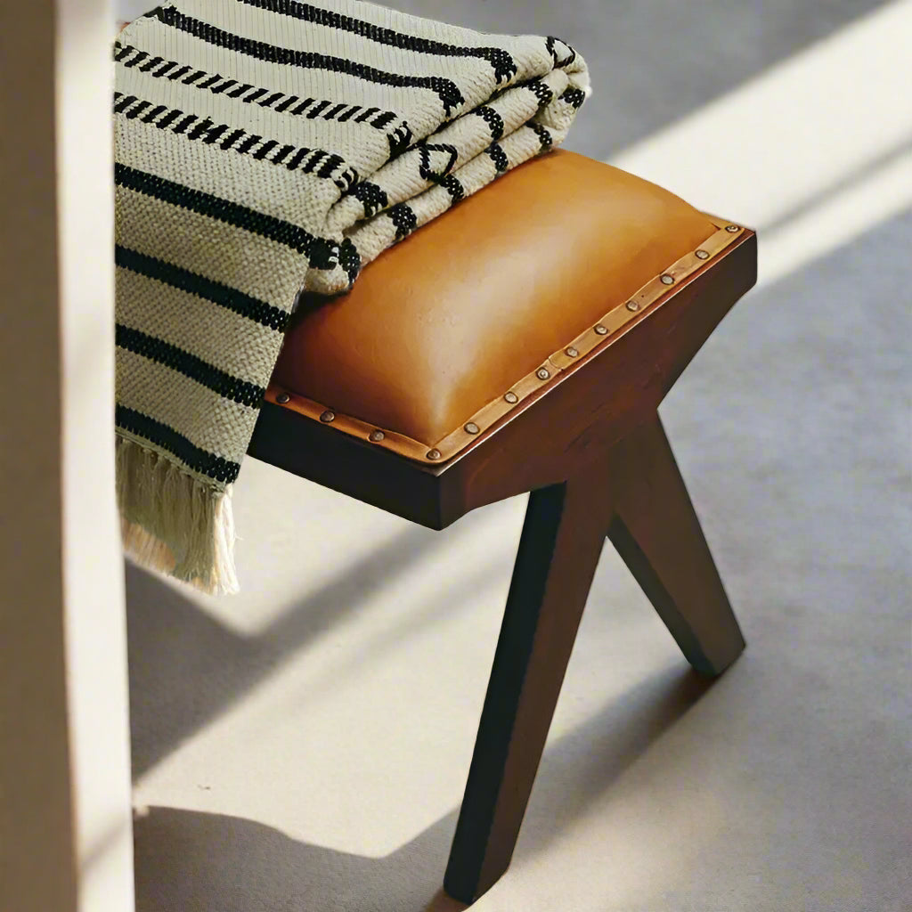 The Inca bench will bring a hint of vintage appeal to home decor with a solid teak frame and elegant angular legs and upholstered in tan leather. Shop online today at www.nobleandnook.co.uk