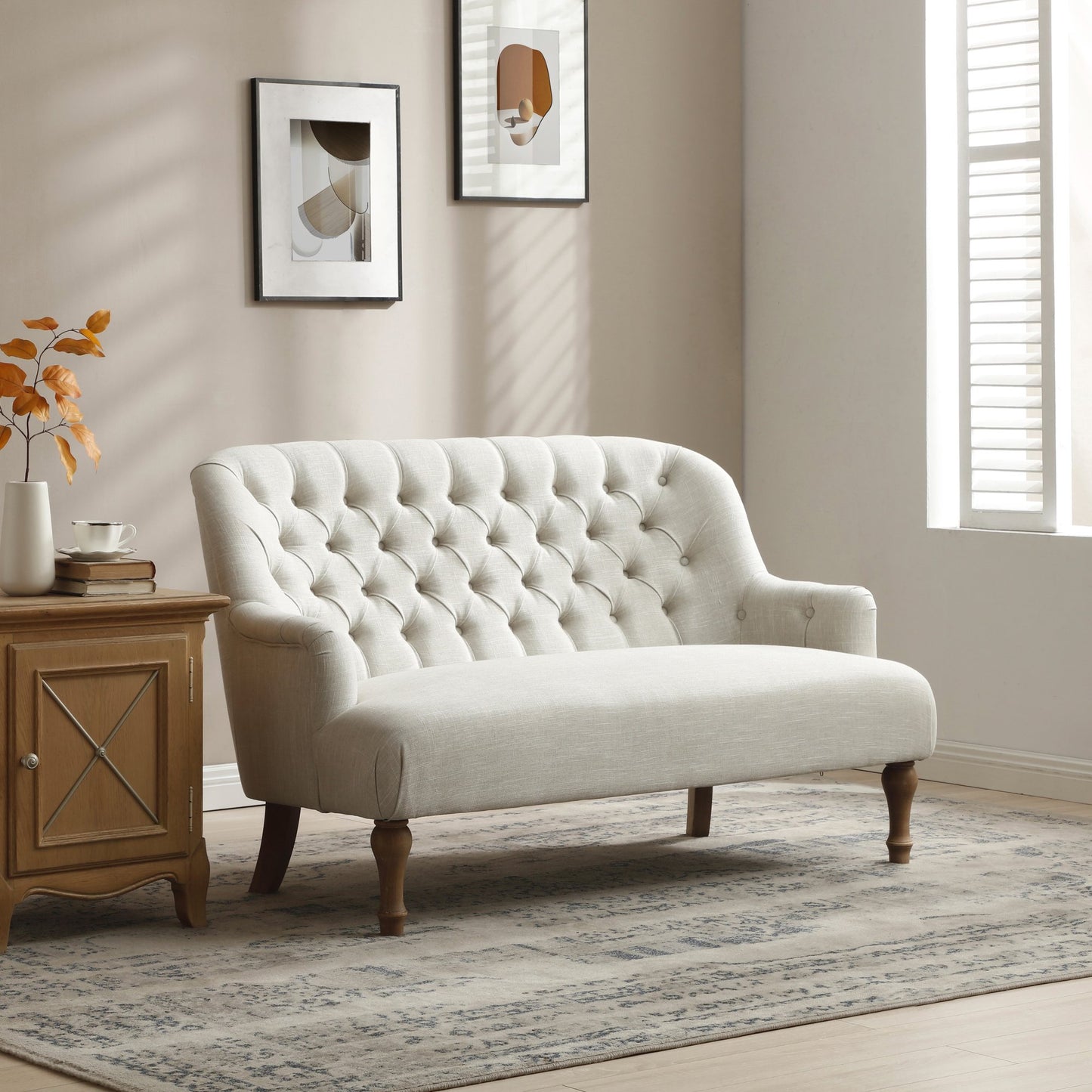 Shop the Bianca 2-Seater Chair, combining classic elegance with superior comfort. Featuring a plump seat, eye-catching tufted back, and traditional washed wooden legs. Shop online at www.nobleandnook.co.uk