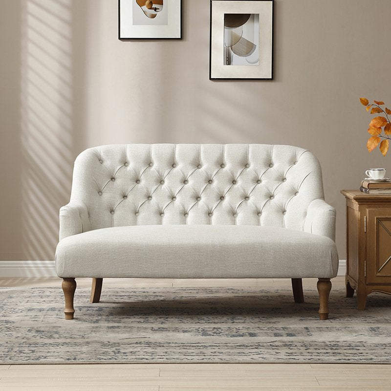 Shop the Bianca 2-Seater Chair, combining classic elegance with superior comfort. Featuring a plump seat, eye-catching tufted back, and traditional washed wooden legs. Shop online at www.nobleandnook.co.uk