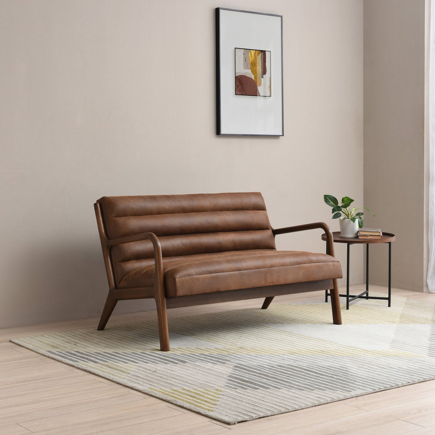 The Inca 2 Seater upholstered in soft touch brown faux leather, an elegantly designed sofa featuring a padded back, seat, and bolster cushion, ensuring exceptional comfort. Shop online today at www.nobleandnook.co.uk