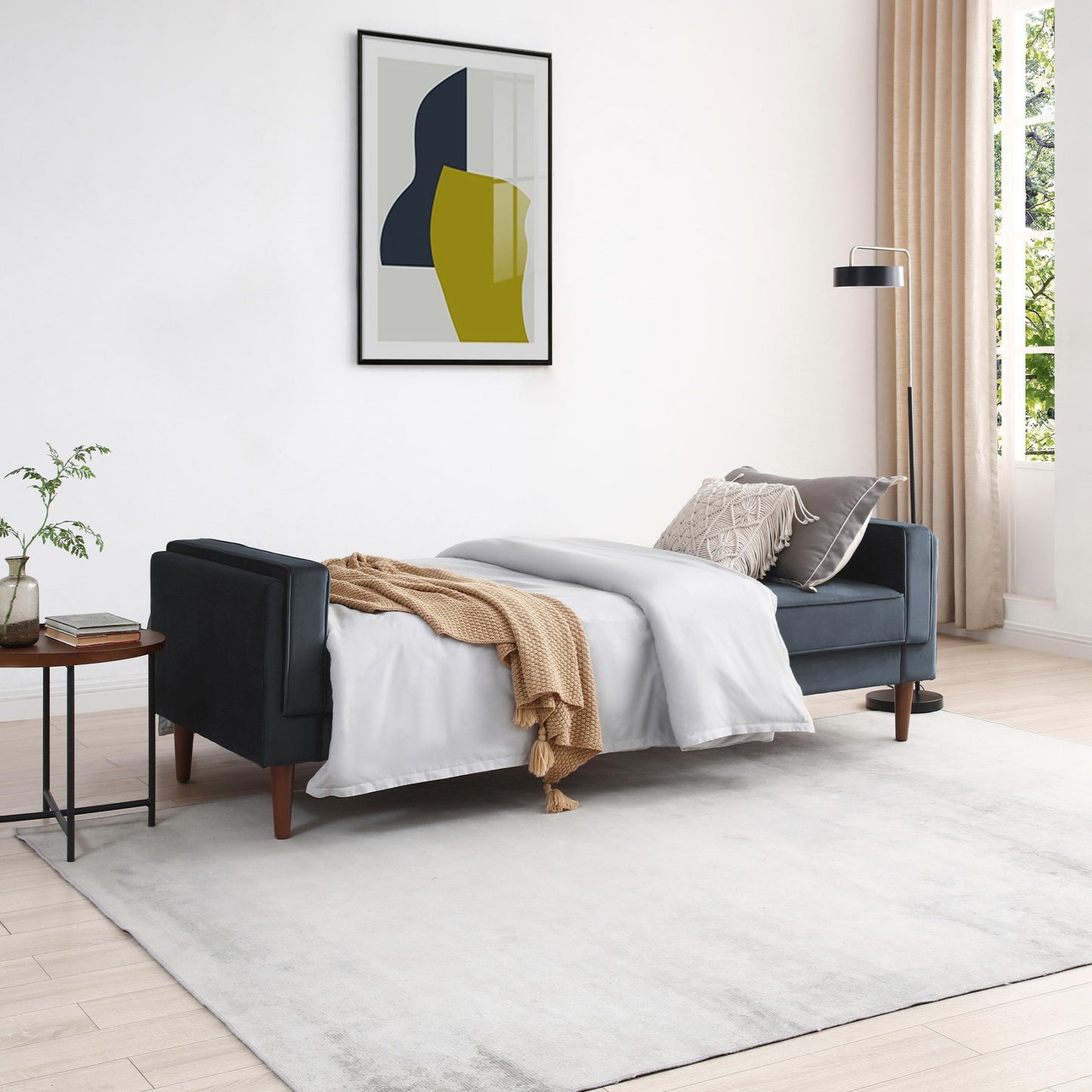 Shop the Paolo Sofa Bed in Ink Blue Velvet, a versatile piece that transitions effortlessly from a comfortable sofa to a practical bed, perfect for guests or compact living spaces. Shop online today at www.nobleandnook.co.uk