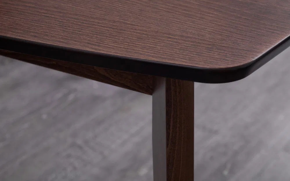 The Kensington Extending Dining Table combines timeless elegance with practical functionality, crafted from solid beech and beech veneers with a rich walnut finish. Shop online today at www.nobleandnook.co.uk