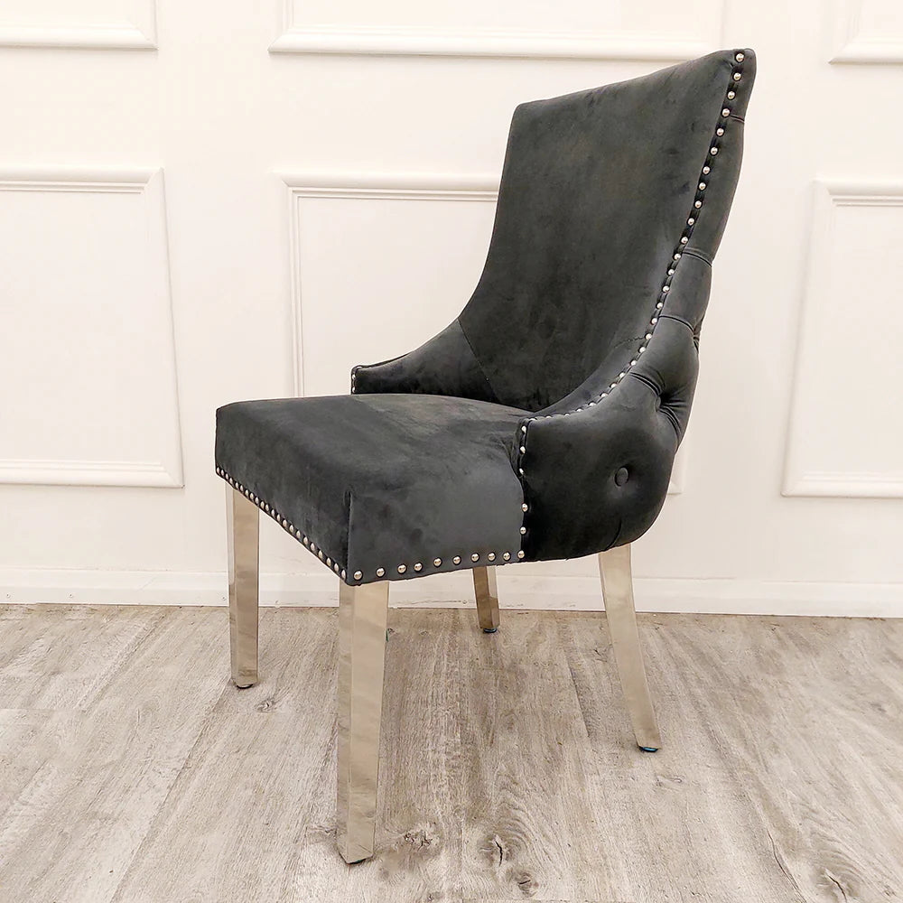 Elevate your dining experience with this exquisite pair of Kensington Velvet Dining Chairs in Dark Grey. Perfect for modern and classic interiors alike. Shop online today at www.nobleandnook.co.uk