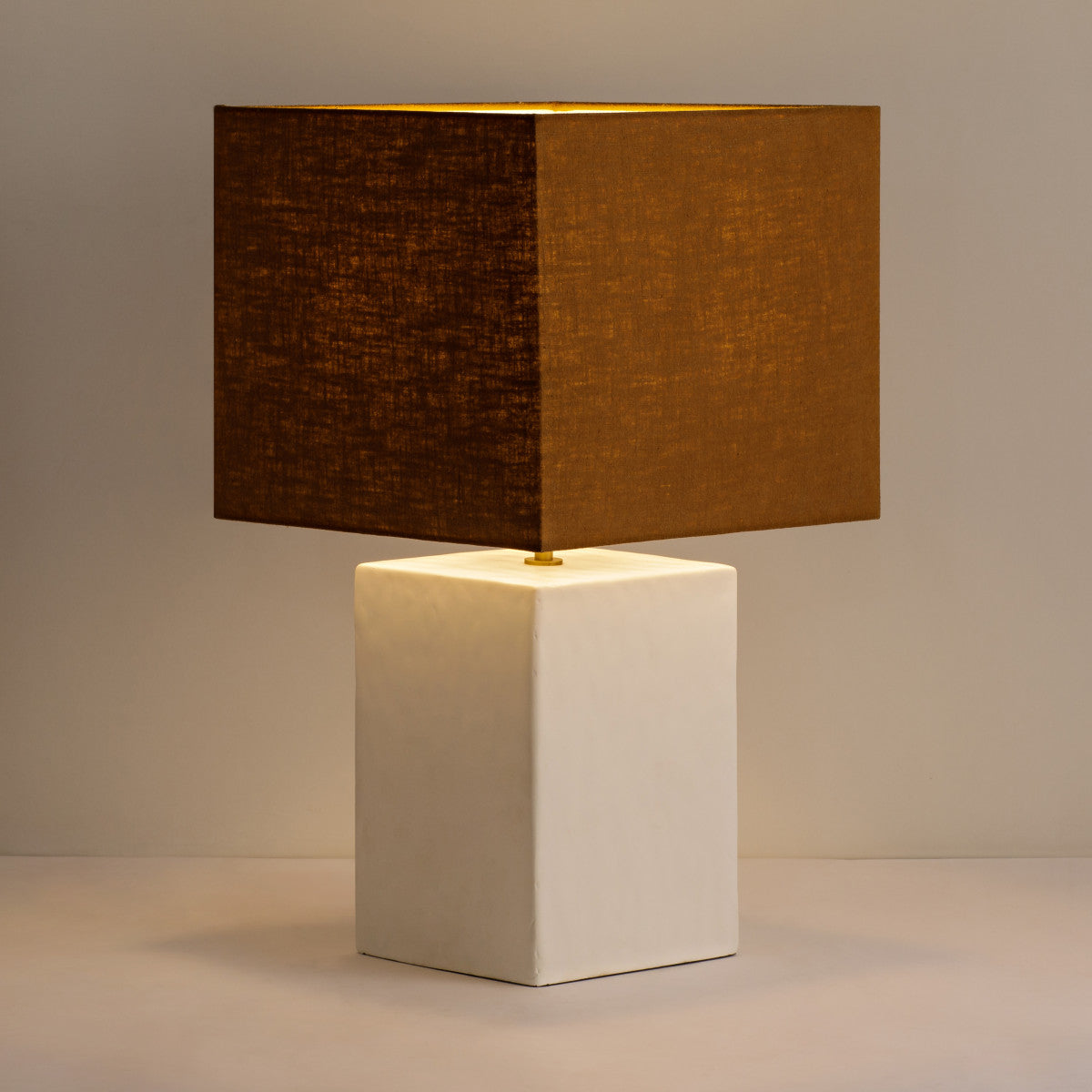 Small Rectangular Gesso Lamp with sculptural rectangular base. Perfect for smaller spaces, this lamp delivers ambient light while serving as a modern accent in any room. W31 x D31 x H55 cm Shop online now at www.nobleandnook.co.uk