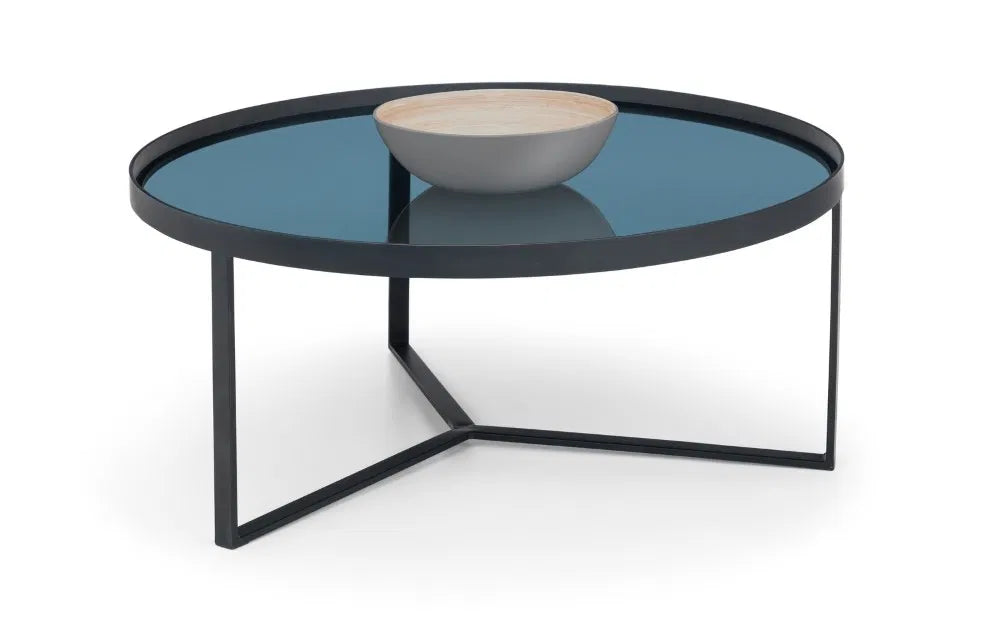 Shop the Soho Coffee Table, a perfect blend of sophistication, featuring a geometric black metal base and a smoked tempered glass top. Shop Online today at www.nobleandnook.co.uk