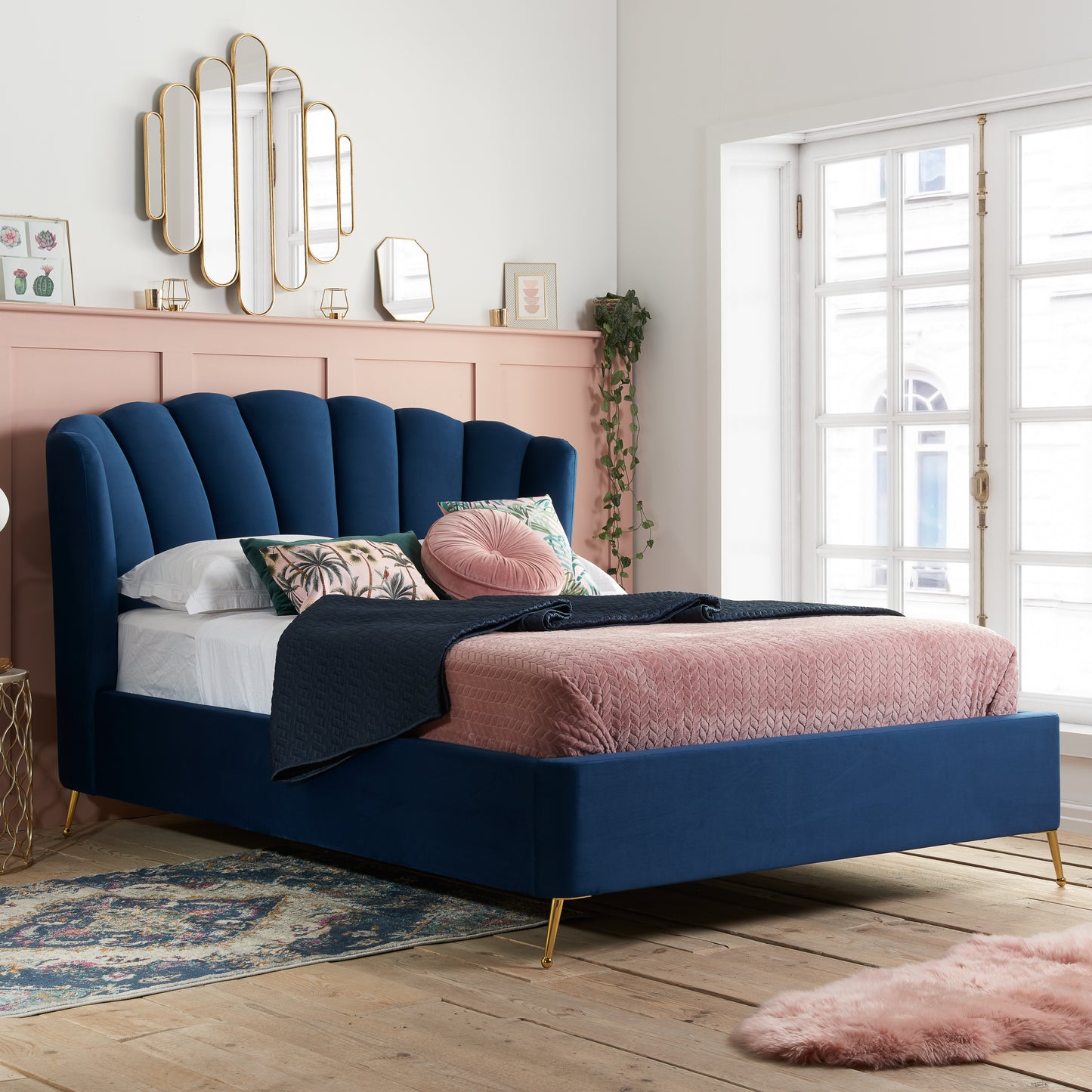 Shop the Lottie Ottoman Bed featuring a pleated and gently winged headboard that adds an elegant art deco touch and is enhanced to by the slim brushed gold feet. Shop online today at www.nobleandnook.co.uk