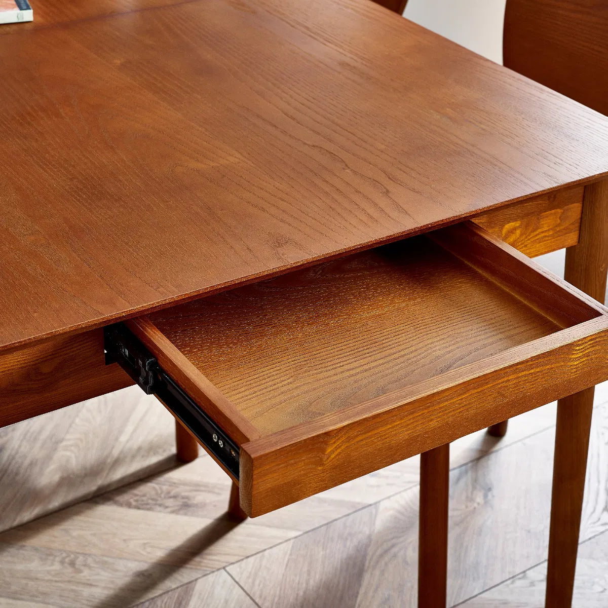 Bring timeless charm and functionality to your dining space with the Lowry Extending Dining Table with 2 Drawers in luxurious cherry ash wood and veneer. H78xD90xW180 cm Shop online today at www.nobleandnook.co.uk