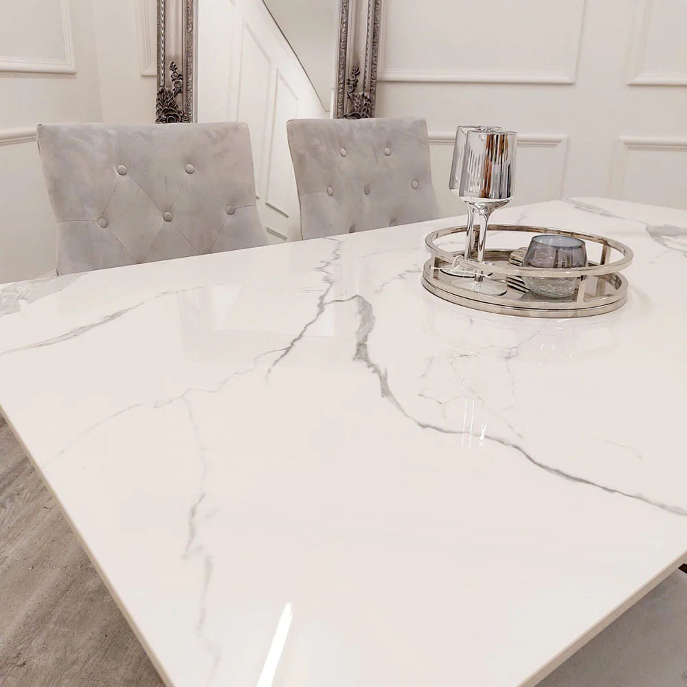 Shop the opulent Lucien Dining Table with Chrome base and luxurious Polar White Sintered Stone Top. At 160cm in length, it can comfortably accommodates 6 chairs. Shop online today at www.nobleandnook.co.uk