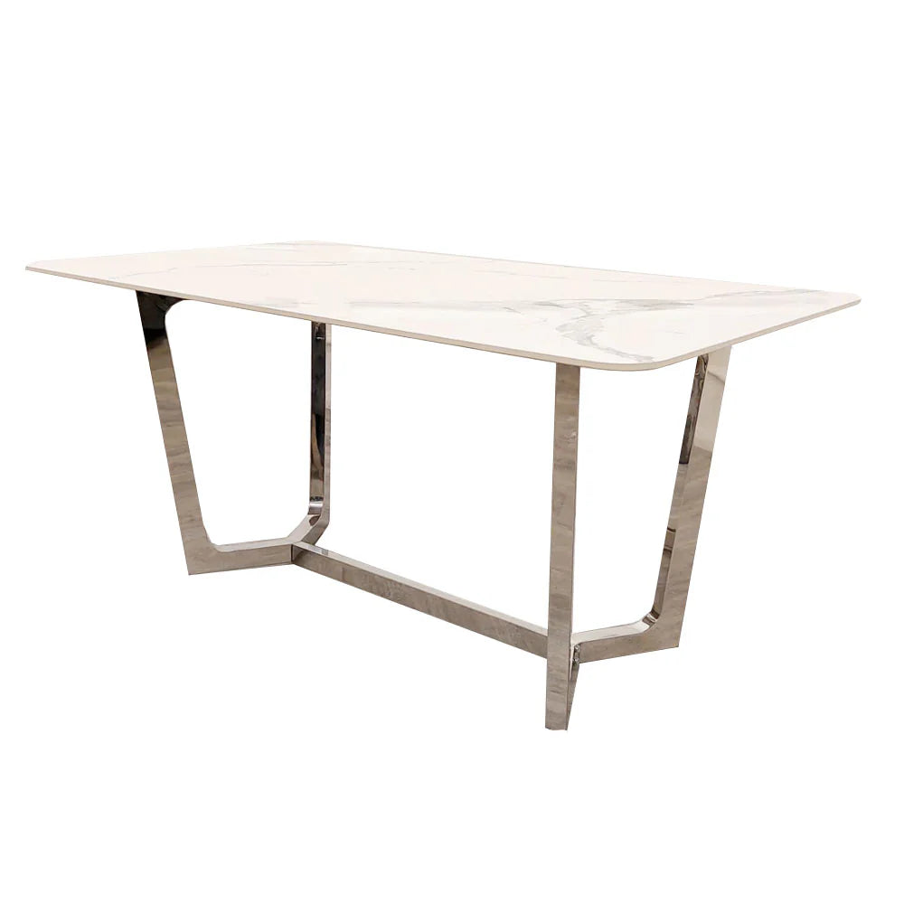 Shop the opulent Lucien Dining Table with Chrome base and luxurious Polar White Sintered Stone Top. At 160cm in length, it can comfortably accommodates 6 chairs. Shop online today at www.nobleandnook.co.uk