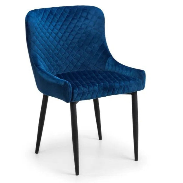 Add a sophisticated touch with the Luxe Blue Velvet Dining Chairs. Upholstered in rich blue velvet with intricate quilted detailing and black-painted legs. Shop online today at www.nobleandnook.co.uk