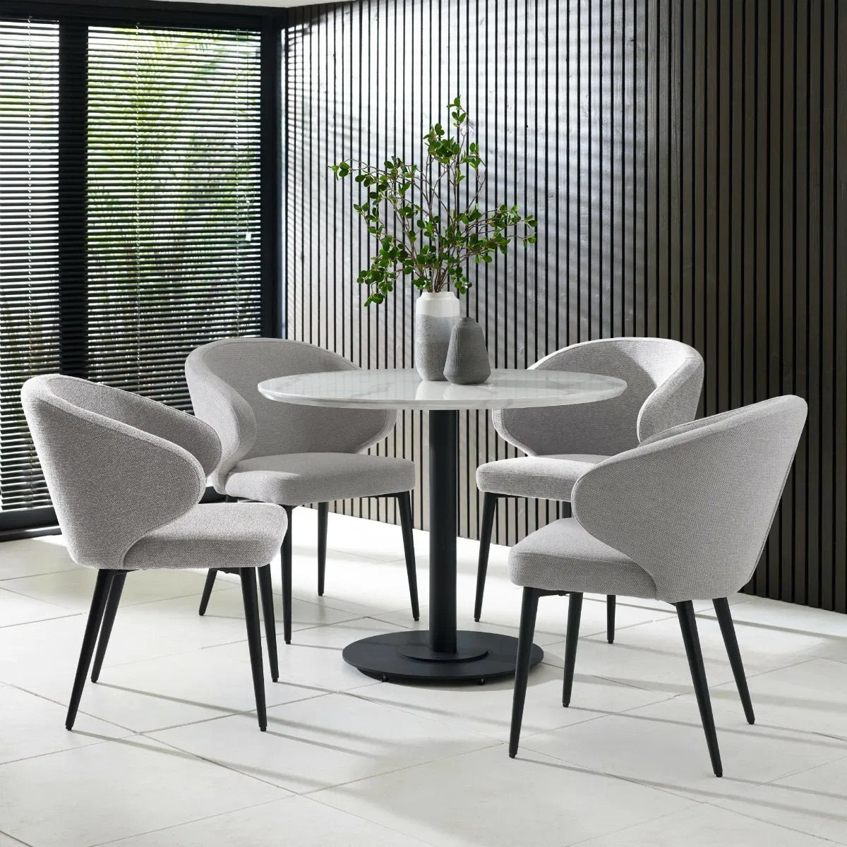 Upholstered in soft, light grey linen-effect fabric with ergonomic curved backrest and padded seat to ensure superior comfort, making them perfect for daily meals or hosting guests. www.nobleandnook.co.uk