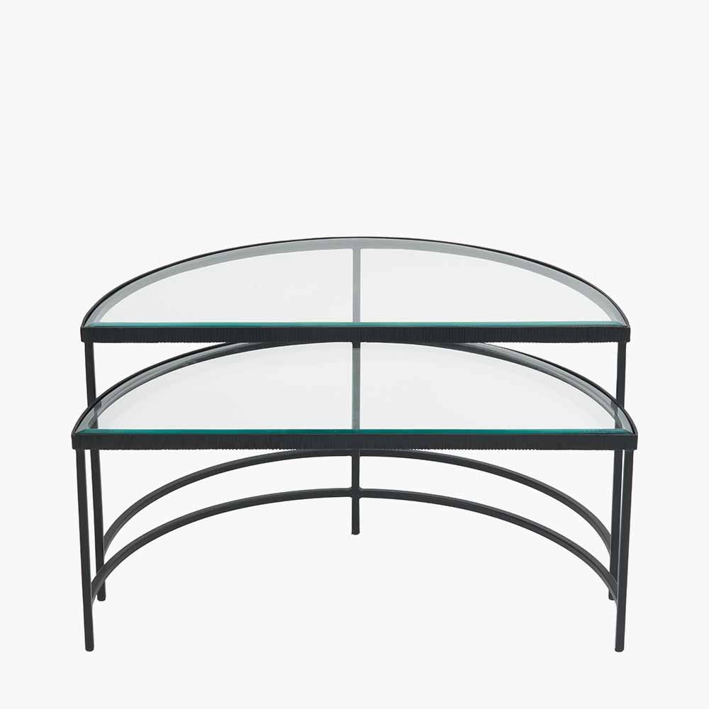 Shop the Marazzi Bevelled Glass & Black Metal Half Moon Coffee Tables, boasting a sleek black metal frame with elegant cast edging and clear, bevel-edged glass tops. Shop online now at www.nobleandnook.co.uk
