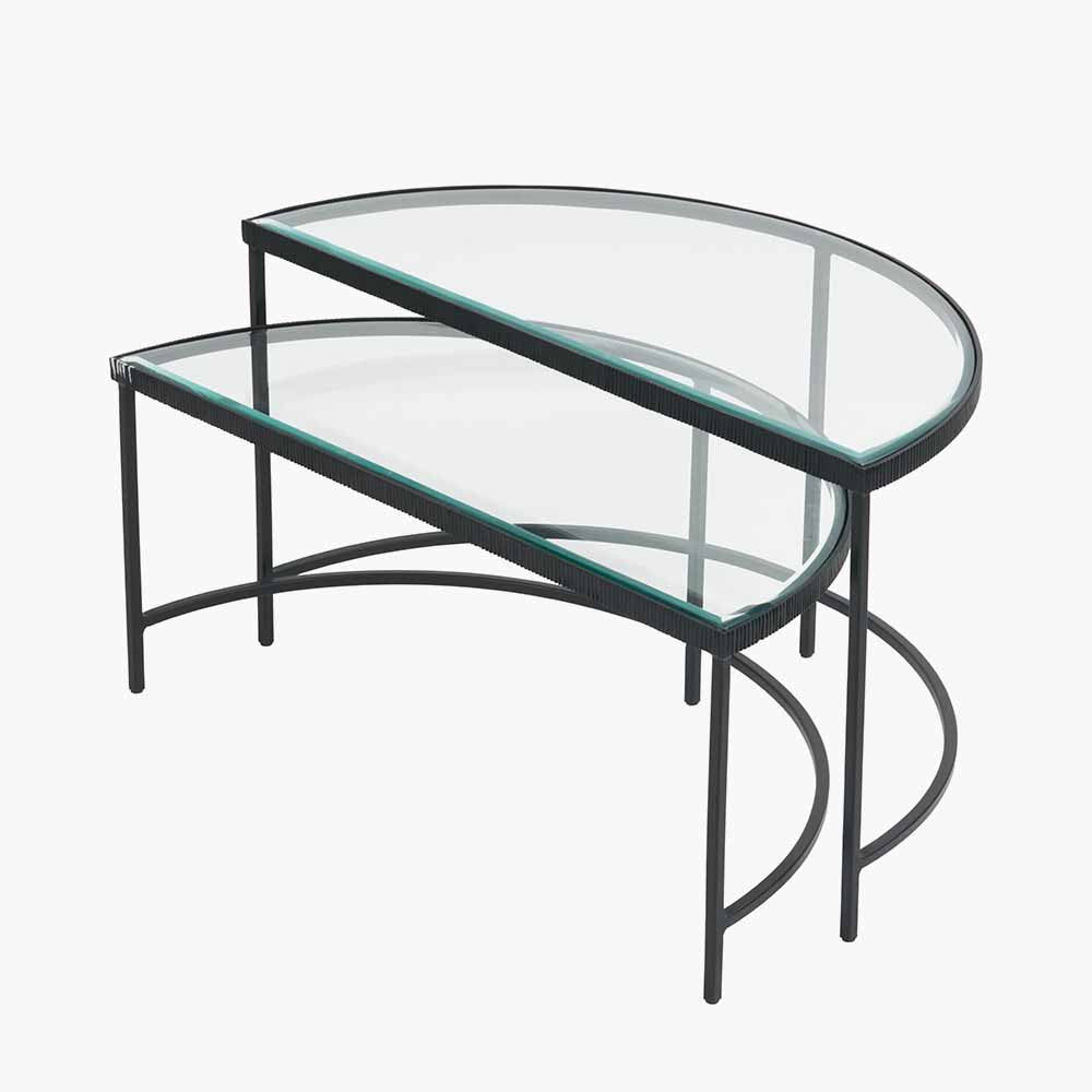 Shop the Marazzi Bevelled Glass & Black Metal Half Moon Coffee Tables, boasting a sleek black metal frame with elegant cast edging and clear, bevel-edged glass tops. Shop online now at www.nobleandnook.co.uk