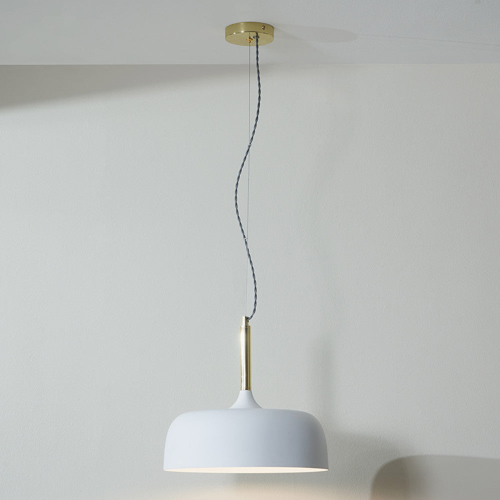 Shop this elegant pendant light featuring a simple yet refined design, with smooth curves and a matt white finish complemented by copper metal accents. Shop online now at www.nobleandnook.co.uk