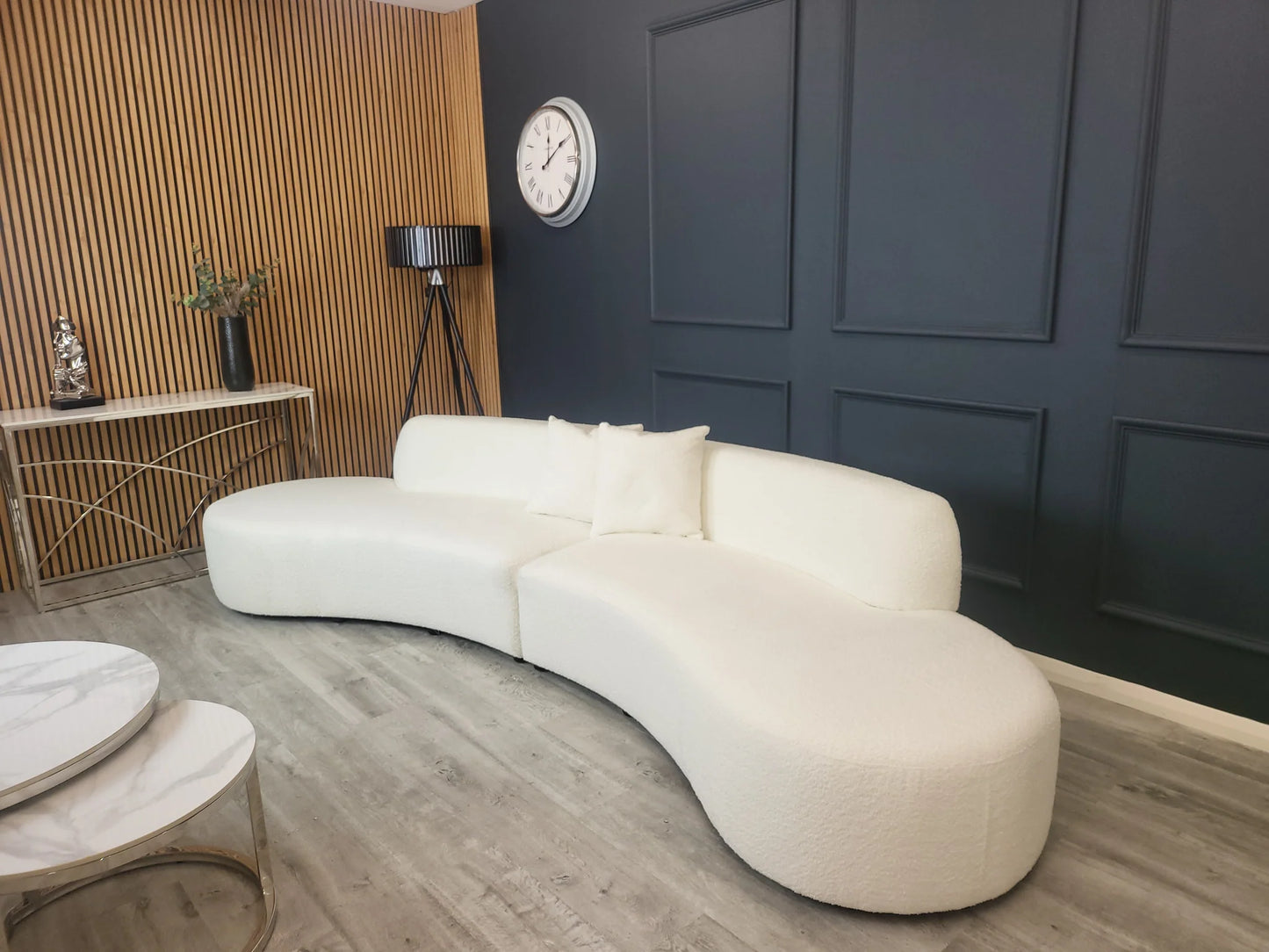 The Miami Curved Cinema Sofa, upholstered in soft and textured bouclé fabric. Perfect for a home games room or home cinema. Shop online today at www.nobleandnook.co.uk