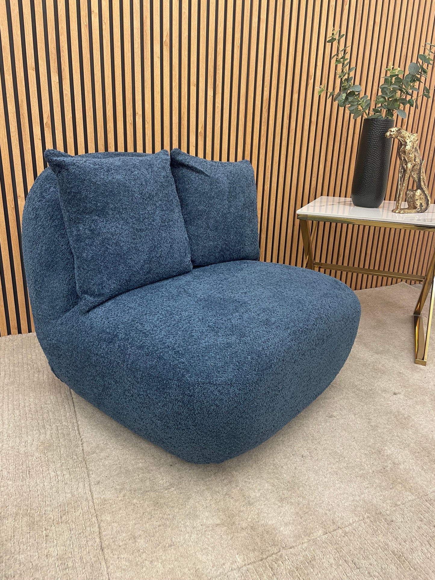 Transform your living space with the Miami Swivel Accent Chair, a striking blend of bold design and luxurious comfort. Upholstered in soft, textured bouclé fabric. Shop online today at www.nobleandnook.co.uk