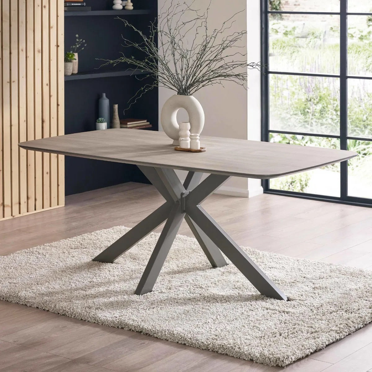 Perfect for family meals, hosting guests, or casual dining, this table features a durable weathered oak-effect laminate top combined solid metal frame. H75 x W160 x D180 cm. Available at www.nobleandnook.co.uk