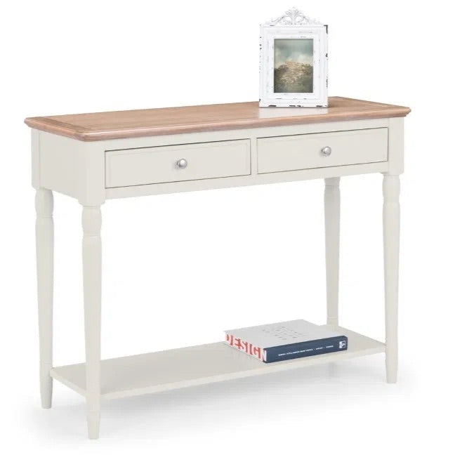The Provence 2 Drawer Console Table in grey lacquer and limed oak effect top and classic turned legs, making it perfect for hallways or living areas. Available today at www.nobleandnook.co.uk