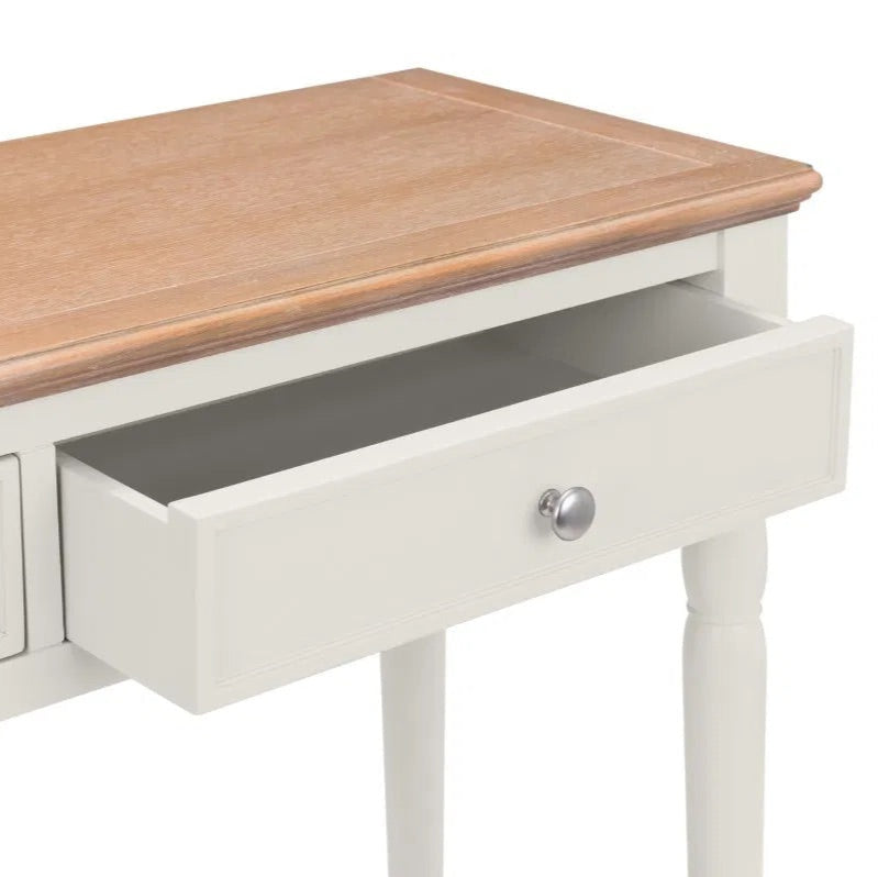 The Provence 2 Drawer Console Table in grey lacquer and limed oak effect top and classic turned legs, making it perfect for hallways or living areas. Available today at www.nobleandnook.co.uk