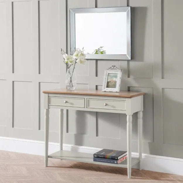 The Provence 2 Drawer Console Table in grey lacquer and limed oak effect top and classic turned legs, making it perfect for hallways or living areas. Available today at www.nobleandnook.co.uk