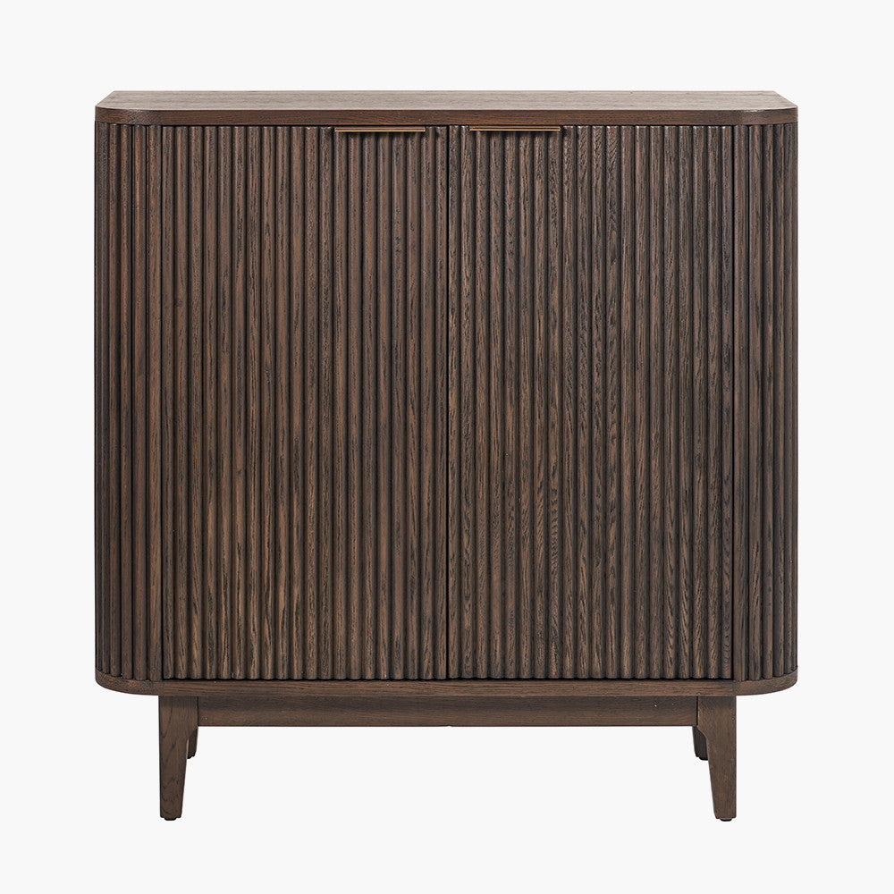 Designed with a striking ribbed oak and pine wood façade and whether used as a drinks cabinet or a statement storage piece, this elegant cabinet adds instant luxury to any interior. Shop online now at www.nobleandnook.co.uk