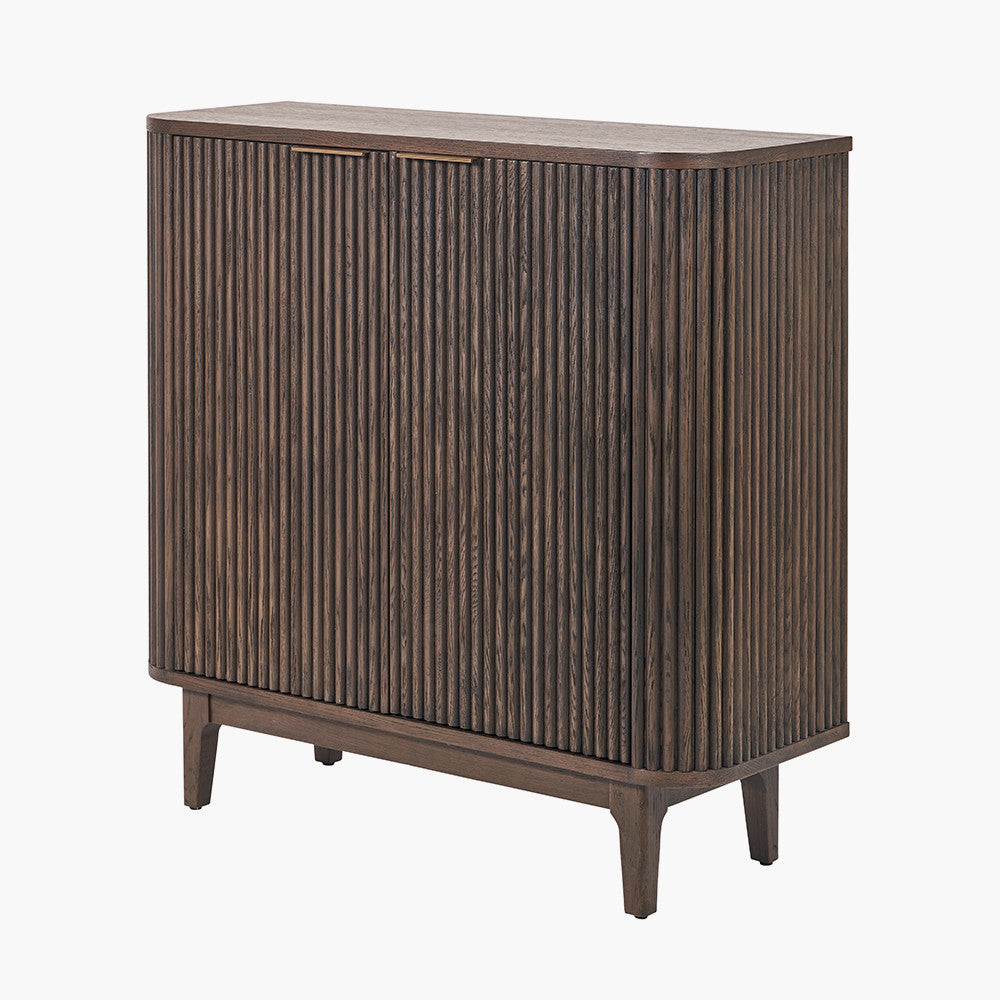 Designed with a striking ribbed oak and pine wood façade and whether used as a drinks cabinet or a statement storage piece, this elegant cabinet adds instant luxury to any interior. Shop online now at www.nobleandnook.co.uk