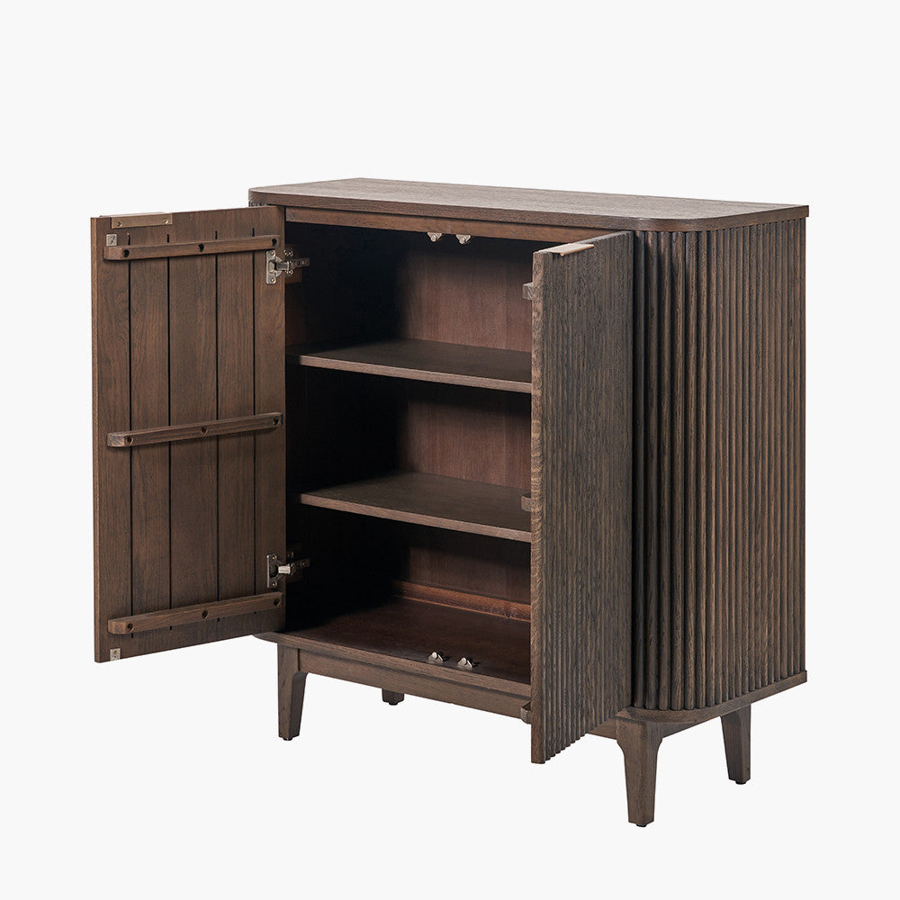 Designed with a striking ribbed oak and pine wood façade and whether used as a drinks cabinet or a statement storage piece, this elegant cabinet adds instant luxury to any interior. Shop online now at www.nobleandnook.co.uk