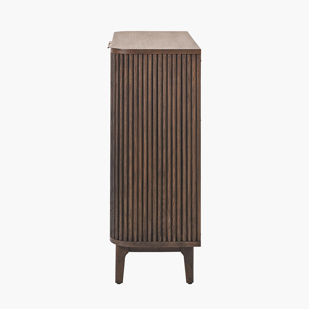 Designed with a striking ribbed oak and pine wood façade and whether used as a drinks cabinet or a statement storage piece, this elegant cabinet adds instant luxury to any interior. Shop online now at www.nobleandnook.co.uk