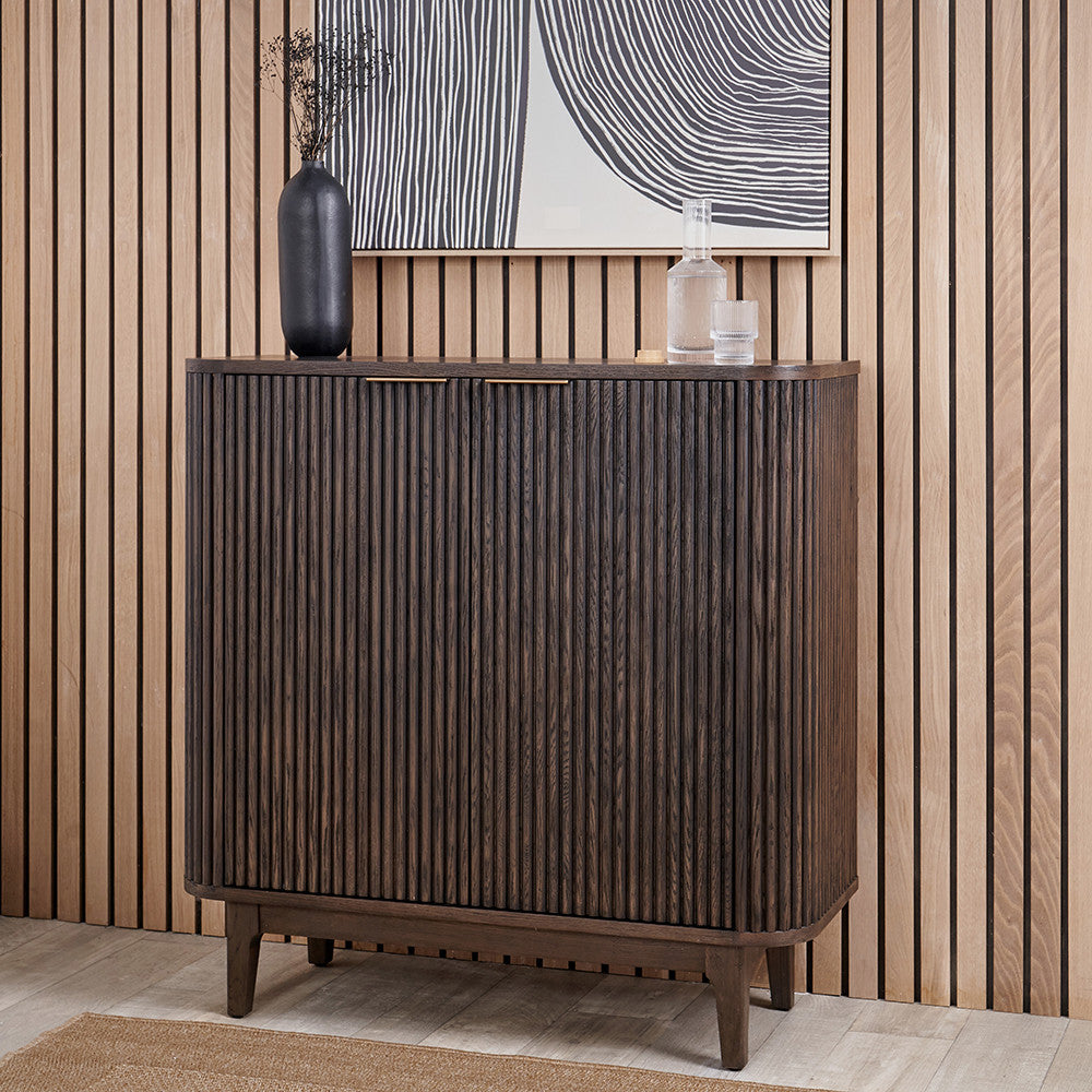 Designed with a striking ribbed oak and pine wood façade and whether used as a drinks cabinet or a statement storage piece, this elegant cabinet adds instant luxury to any interior. Shop online now at www.nobleandnook.co.uk