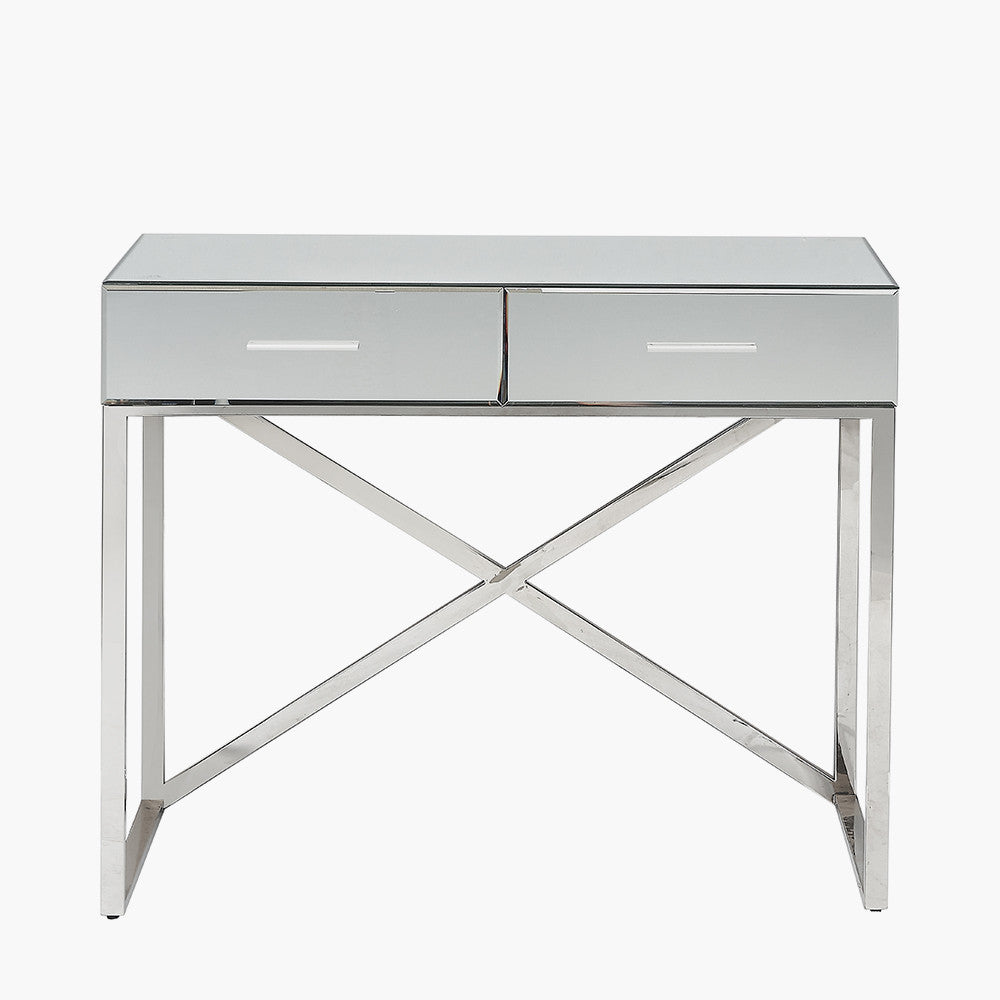 Shop this mirrored glass desk, designed to make a statement. With two spacious drawers, complete with slimline silver handles. Shop online today at www.nobleandnook.co.uk