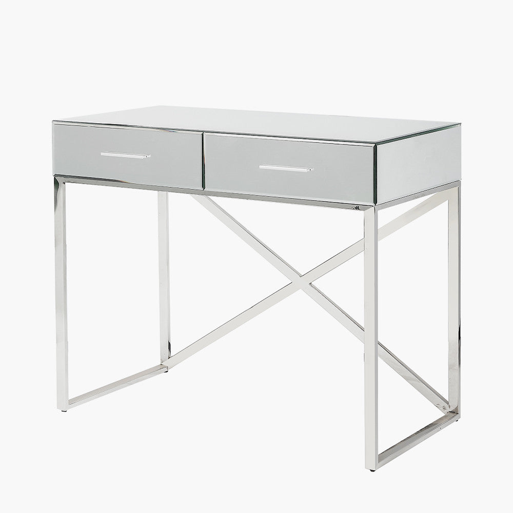 Shop this mirrored glass desk, designed to make a statement. With two spacious drawers, complete with slimline silver handles. Shop online today at www.nobleandnook.co.uk
