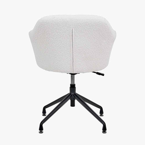 Shop the Rosolini home office chair, upholstered in soft bouclé fabric, with swivel and adjustable height function for personalised comfort. Shop online today at www.nobleandnook.co.uk