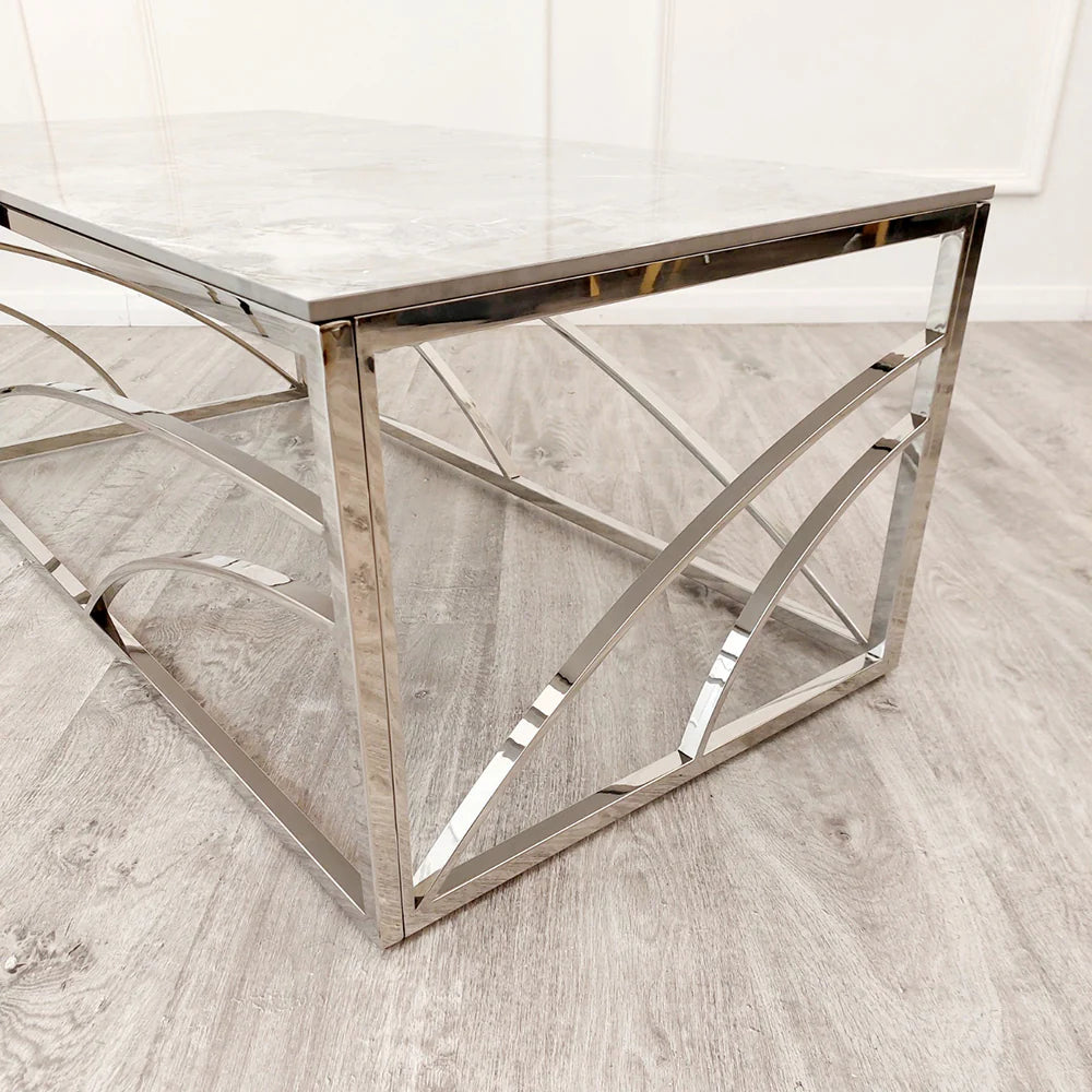 Shop today and enhance your living space with this Chrome Coffee Table, a perfect fusion of art deco inspired style and practicality, featuring a stunning marble effect Sintered Stone top. Shop online today at www.nobleandnook.co.uk